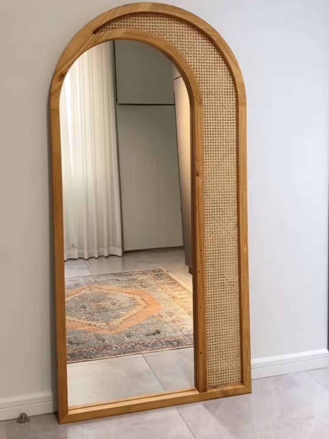 The Solari Arched Rattan Floor Mirror